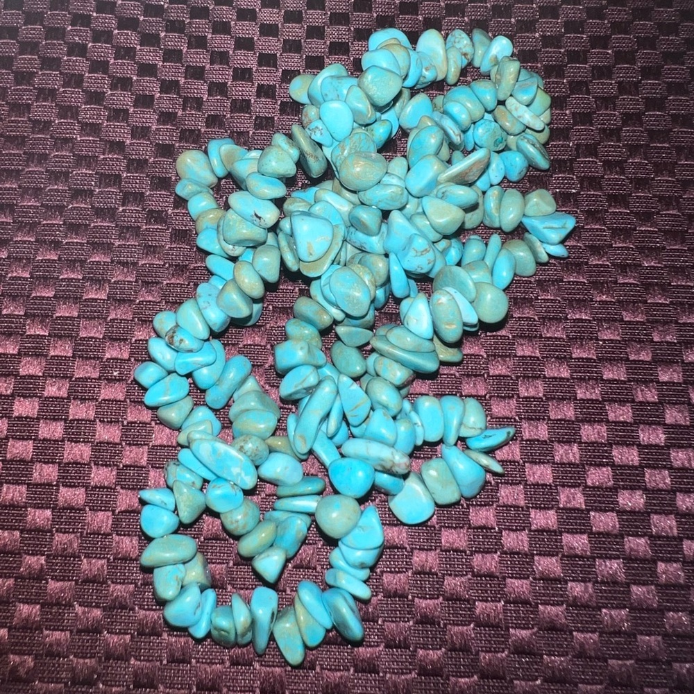 Turquoise colored long necklace